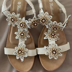 Cute gold sandals with flowers
